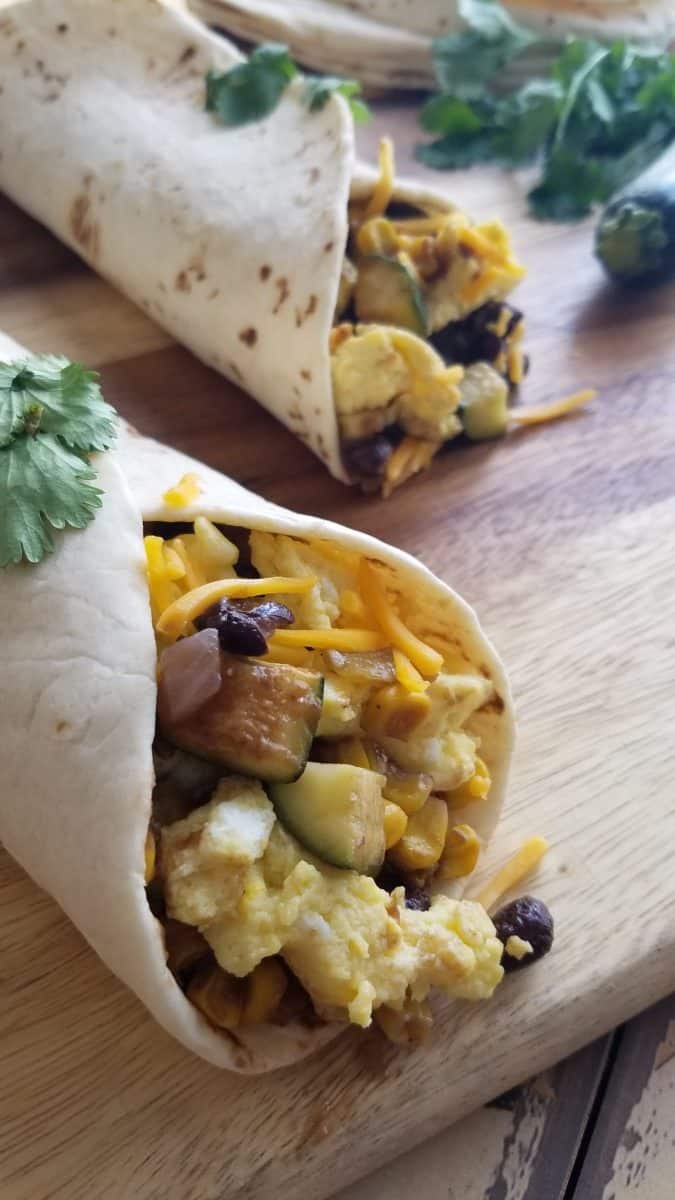 Two vegetarian breakfast burritos made using Hatch Green Chile Sauce